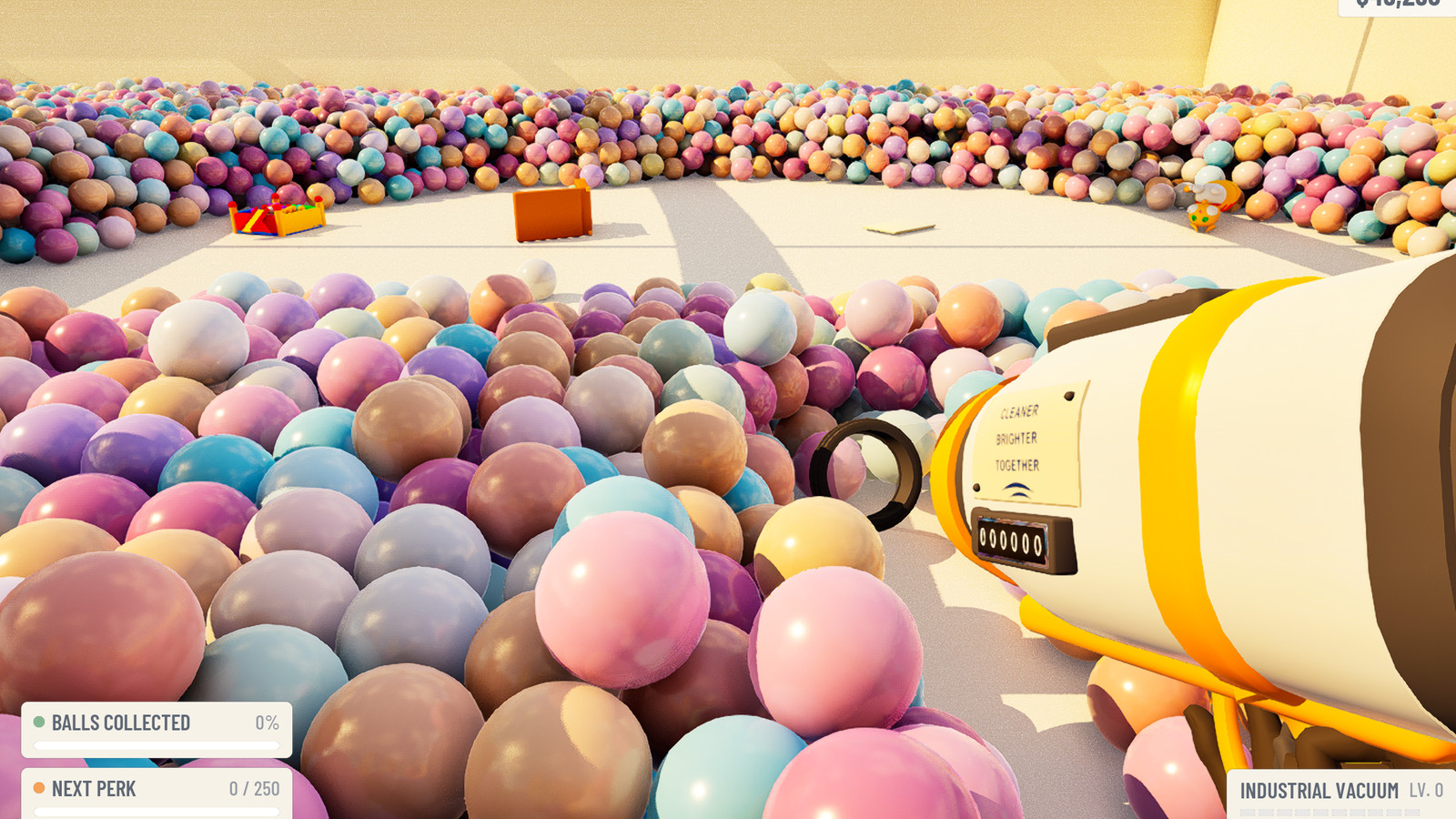 A wide crater cleared out of the ball pit, bare floor exposed at the bottom with lost objects sitting on it, a wall of pastel balls all around.