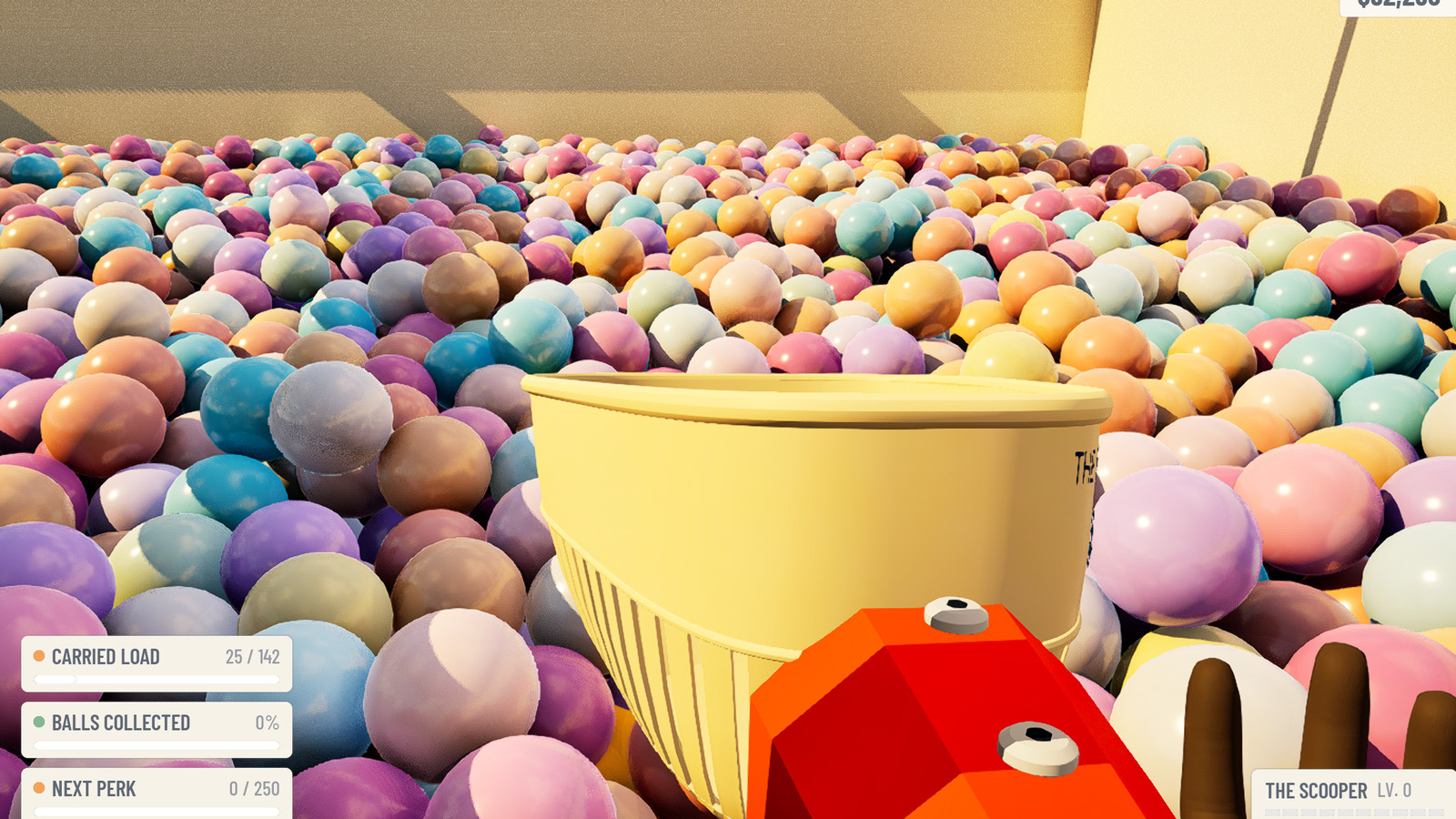 The Scooper, a cream basket on a bright orange handle, dipped into a deep bed of pastel balls.