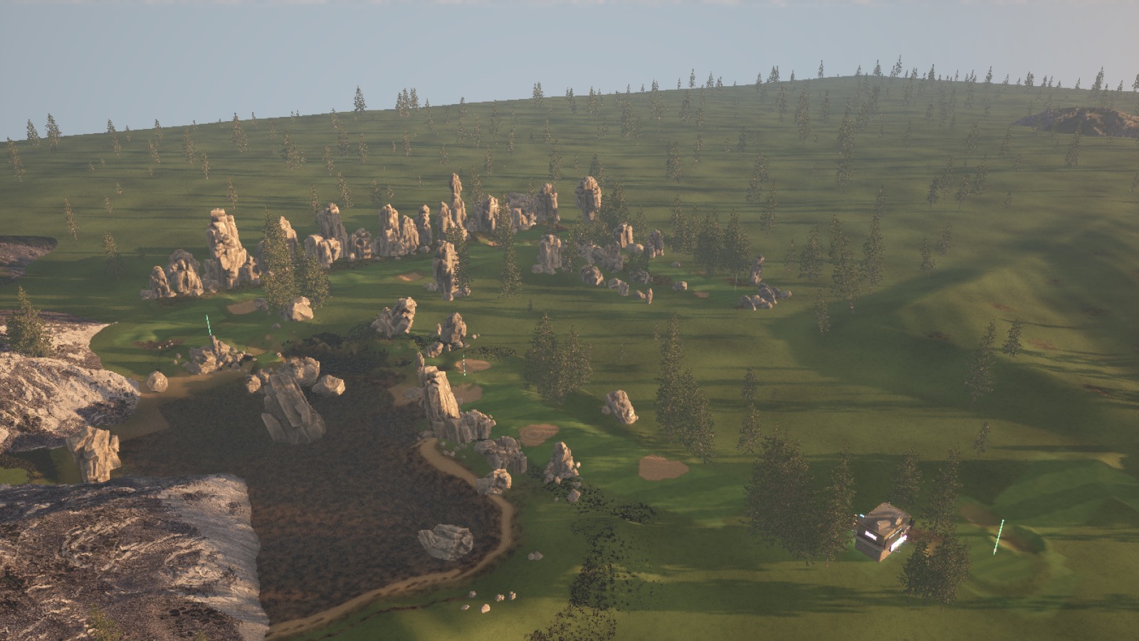 Aerial view of the course at low sun, long tree shadows across the fairways.